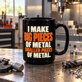 AI-generated workshop mockup of the black 15 oz I Make Big Pieces of Metal Smaller Pieces of Metal machinist mug, orange and ivory text facing the camera.