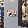 Illustrative mockup of Flying Parts Have Right of Way magnet fully supported on a CNC machine steel panel.